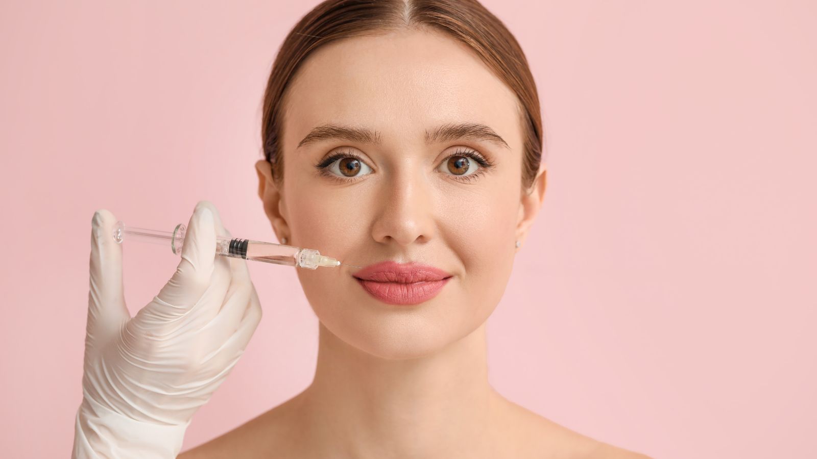 Smiling woman injected on her lips.